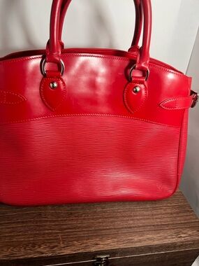 Louis Vuitton Epi Leather Passy handbag in the Rouge colorway.